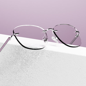 Black optical glasses on blue display