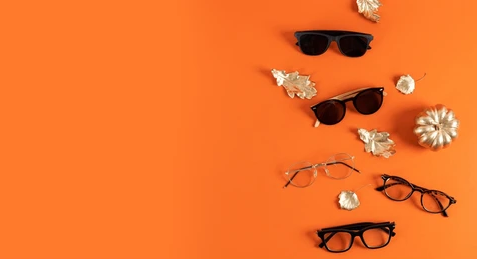 Designer eyewear collection on orange background